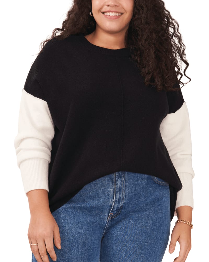 Front of a model wearing a size 1X Layla Colorblock Sleeve Sweater in RICH BLACK by Vince Camuto. | dia_product_style_image_id:261951